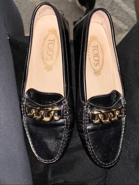 Tod's Black Leather Loafers with Gold Chain Trim